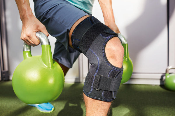 Load image into Gallery viewer, Actimove® Knee Brace Wrap Around, Simple Hinges, Condyle Pads